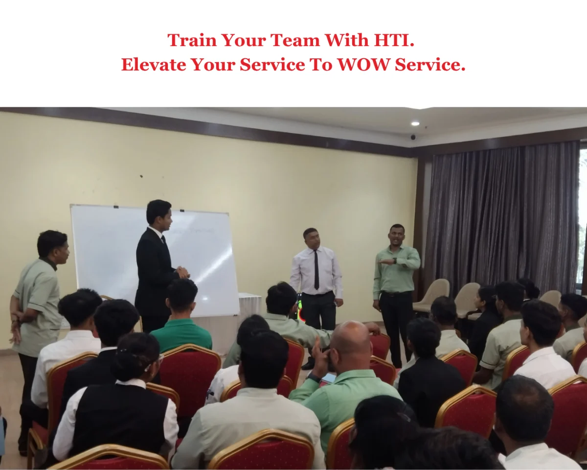 An HTI hospitality training session in progress with a hotel and restaurant team