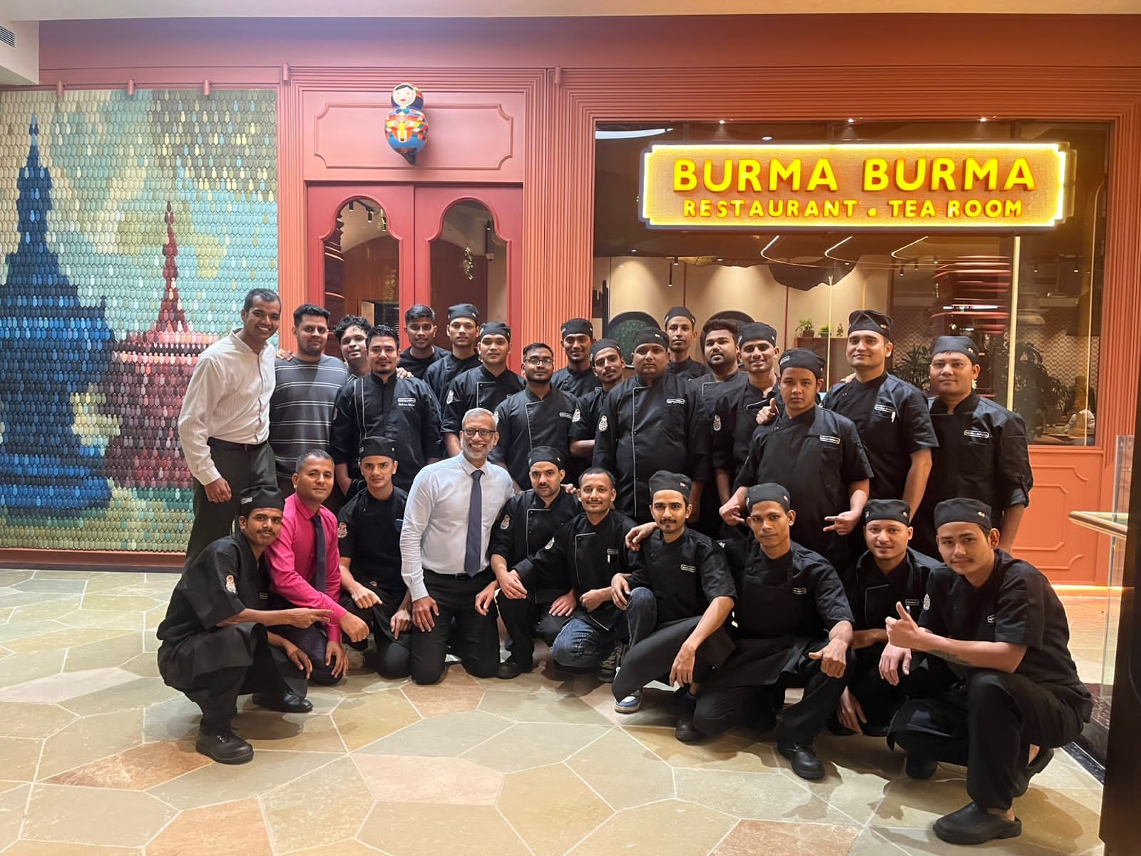 A restaurant service and kitchen team after completing an HTI on-site training program