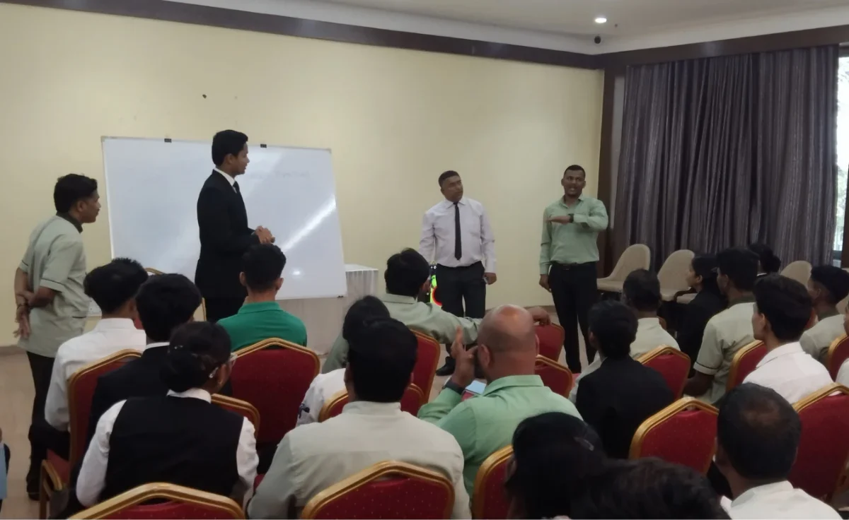 HTI trainers running a live role-play session with hotel service staff