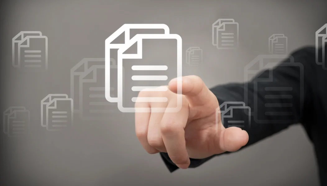 Hand reaching for a document icon, representing SOPs and policies written by HTI Dox