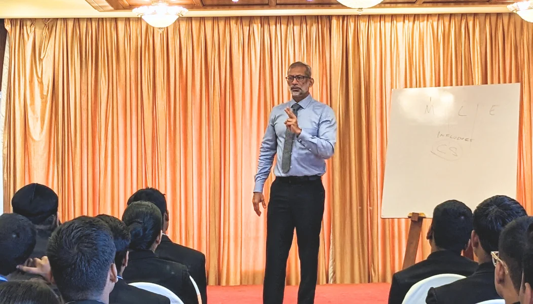HTI facilitator addressing managers during a Lead by HTI leadership development program