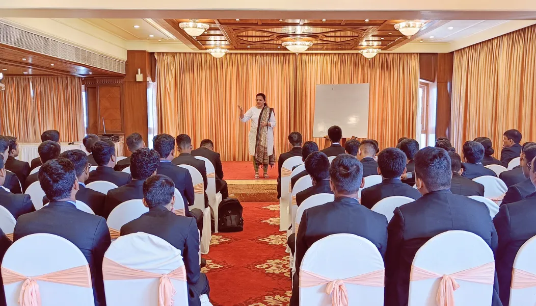 Trainee addressing a large audience during an HTI Star public speaking program