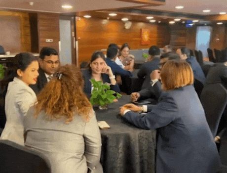 Participants in a group discussion round during a Lead by HTI GD and PI workshop