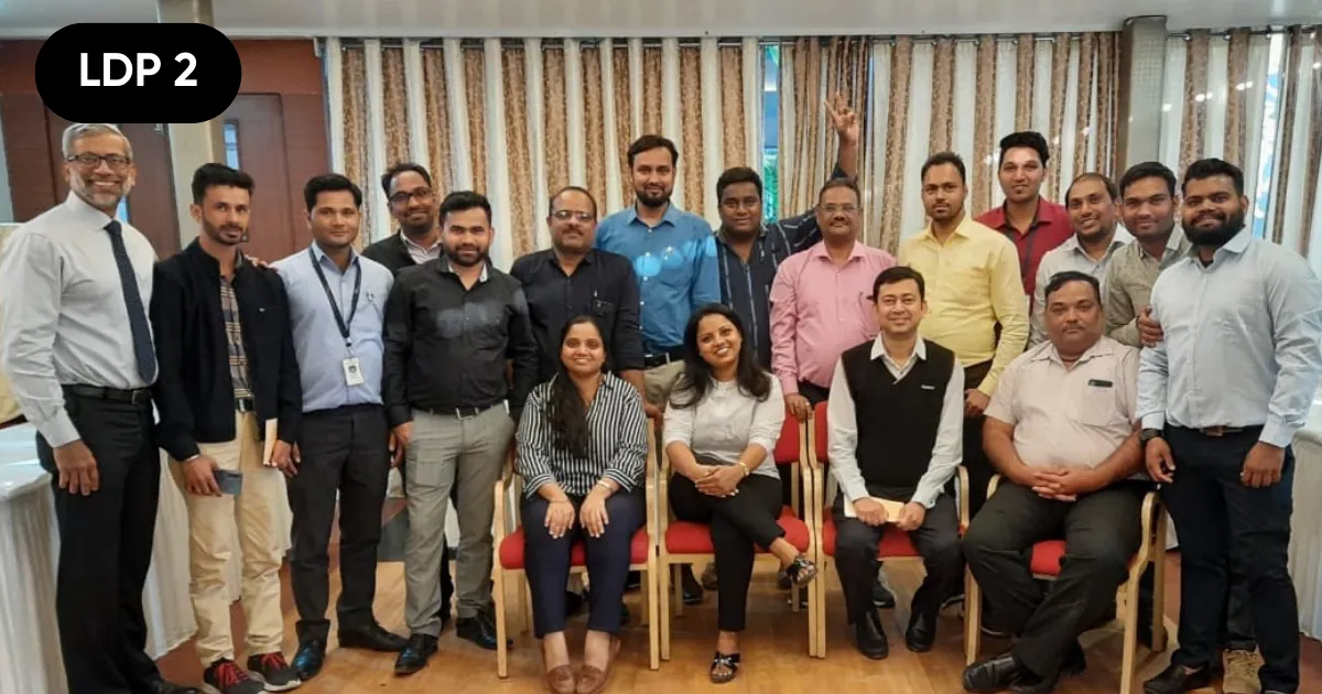 A full batch of managers photographed after HTI's Strategic Communication workshop