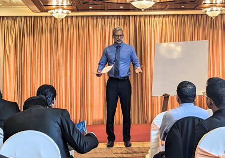 An HTI trainer leading a session with a hospitality team